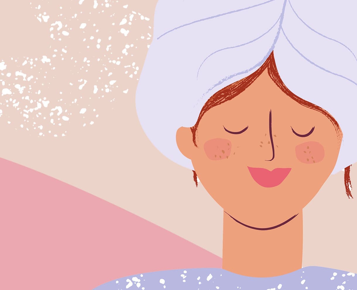 Femme avec un turban représentant la phase de pose pendant l’application du traitement Herbatint Vegetal Color