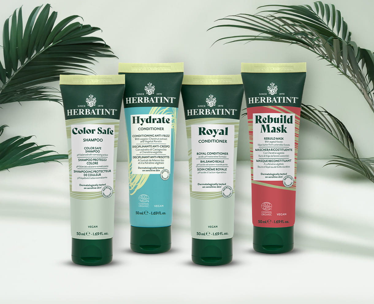 Four Herbatint travel-size products on a light background – Color Safe shampoo, Hydrate and Royal conditioners, Rebuild Mask, ideal for colored and sensitive hair